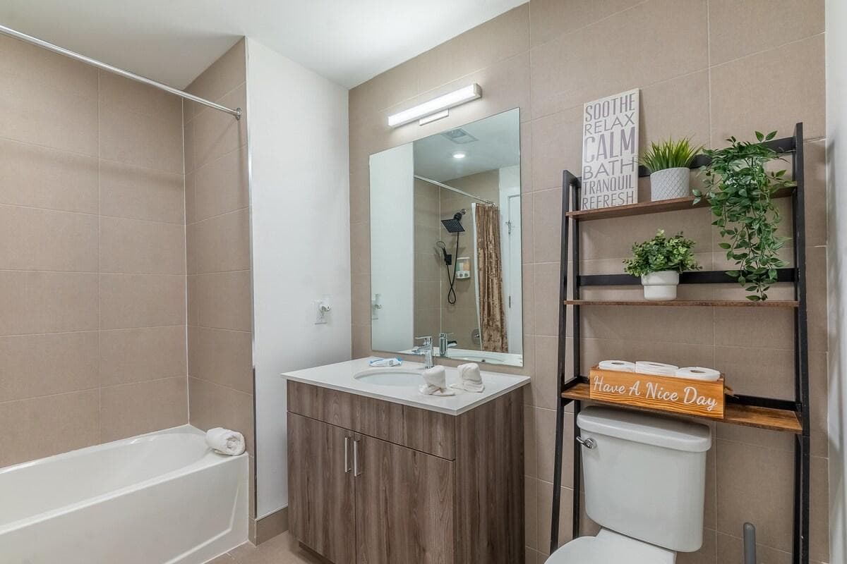 Full Bathroom with toilet, shower and tub 