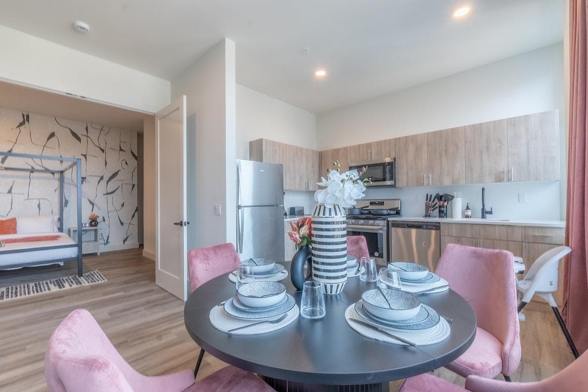 Fully equipped kitchen with essential appliances and cookware.